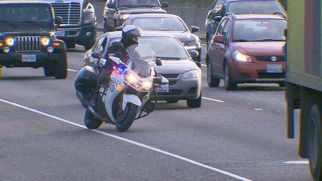 A PPB motorcycle officer on I-5, February 2015 (KOIN 6 News)