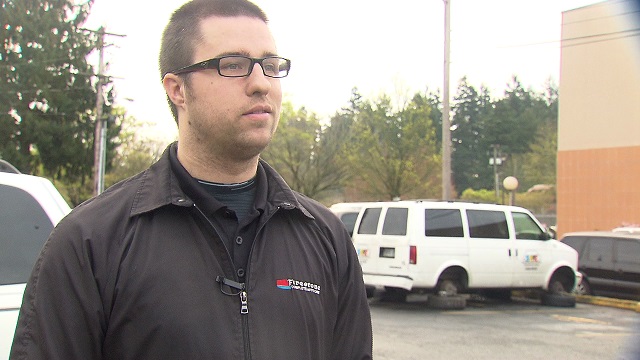 Nick Dunn from Happy Valley Firestone helped get the slashed tires on the fleet of vehicles from SAFE Transportation changed, March 18, 2015 (KOIN 6 News)