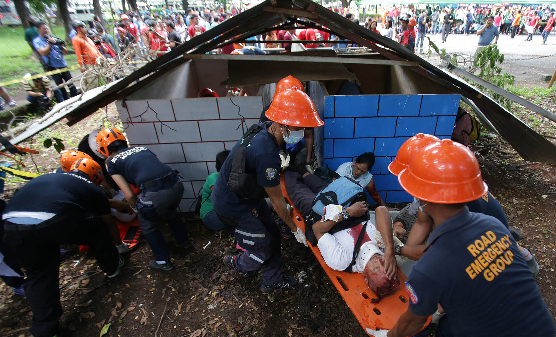 Filipino rescuers evacuate a mock victim from a "collapsed structure" during a Metropolitan Manila-wide earthquake drill. (AP Photo/Aaron Favila)