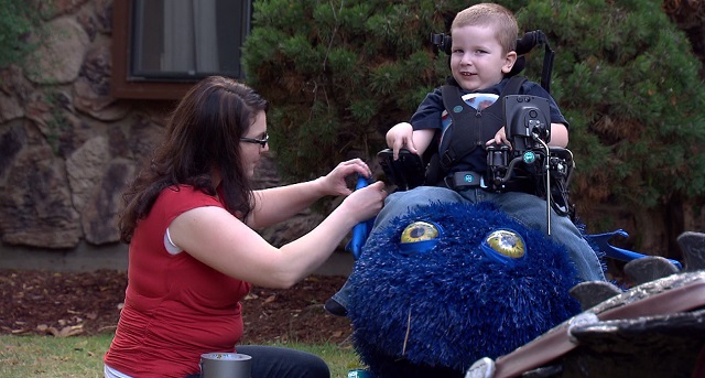 Bryce Weimer sits in his Halloween costume made by his dad, Ryan, who began a non-profit called Magic Wheelchair, Oct. 29, 2015 (KOIN)