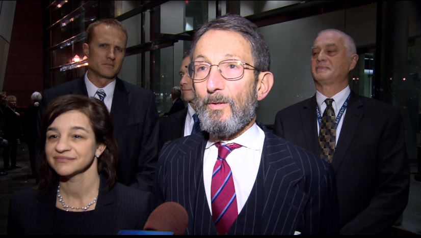 Assistant United States Attorneys Michelle Holman Kerin and Allan M. Garten speaking to media outside the federal courthouse in downtown Portland.