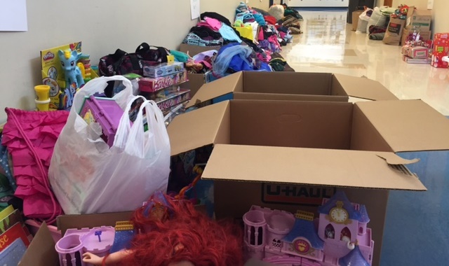 A hallway at Bilquist Elementary in Clackamas filled with donations for the family of Sami Smith, who lost everything in a house fire, Dec. 18, 2015 (KOIN)