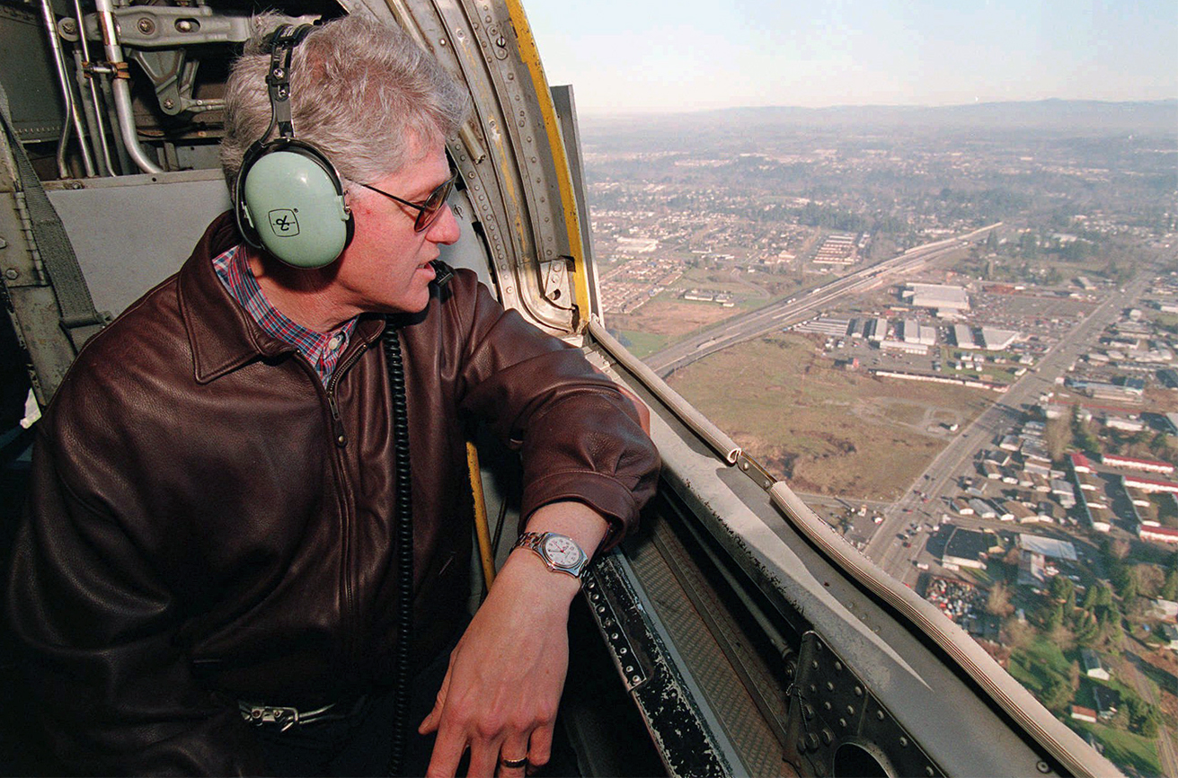 President Bill Clinton surveys flood-damaged areas near the Columbia River Wednesday, Feb. 14, 1996 as he flies aboard Marine One helicopter from Portland to Woodland, Wash. (AP Photo/Wilfredo Lee, pool)