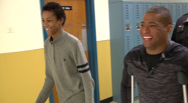 HB Lee Middle School student Elijah Mott, left, and his hero, national champion wrestler Anthony Robles, Feb. 16, 2016 (KOIN)