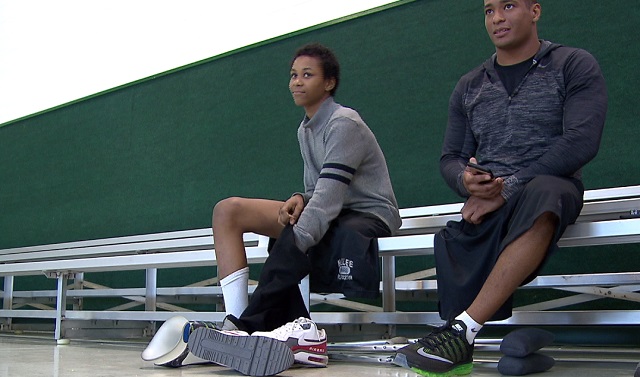 HB Lee Middle School student Elijah Mott, left, and his hero, national champion wrestler Anthony Robles, Feb. 16, 2016 (KOIN)