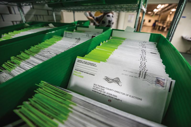 Ballots are sorted at the Multnomah County elections office._365889