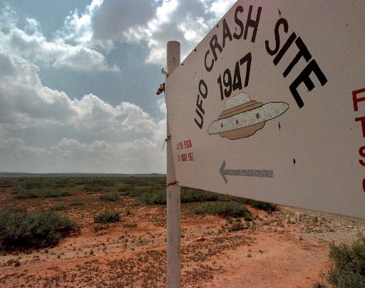 A sign directs travelers to the start of the "1947 UFO Crash Site Tours" in Roswell, N.M., Tuesday, June 10, 1997. In Roswell, locals don't argue anymore about whether a space ship crashed nearby. They argue about whose ranch it landed on. (AP...