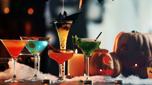 Colorful cocktails and decor for Halloween party, on blurred bac_537283