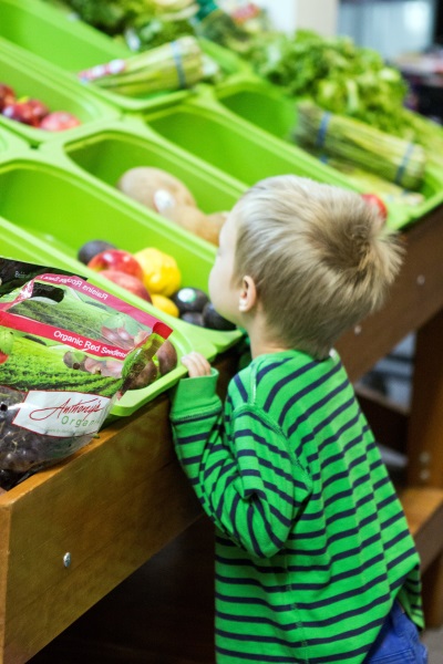 A child visits the Sunshine Division food pantry in a file photo from Portland Police._546675