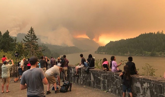 People watch the Eagle Creek Fire grow in the Columbia River Gorge, September 4, 2017 (Facebook: Eagle Creek Fire)