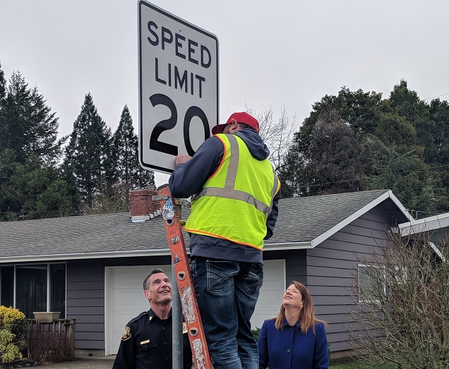 A PBOT worker changes the speed limit sign on a Portland street, February 6 2018. (KOIN)