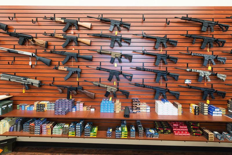 A wall of shotguns and rifles at the Arm Yourself Gun Store in Hillsboro on Oct. 13, 2017. assault rifles weapons generic