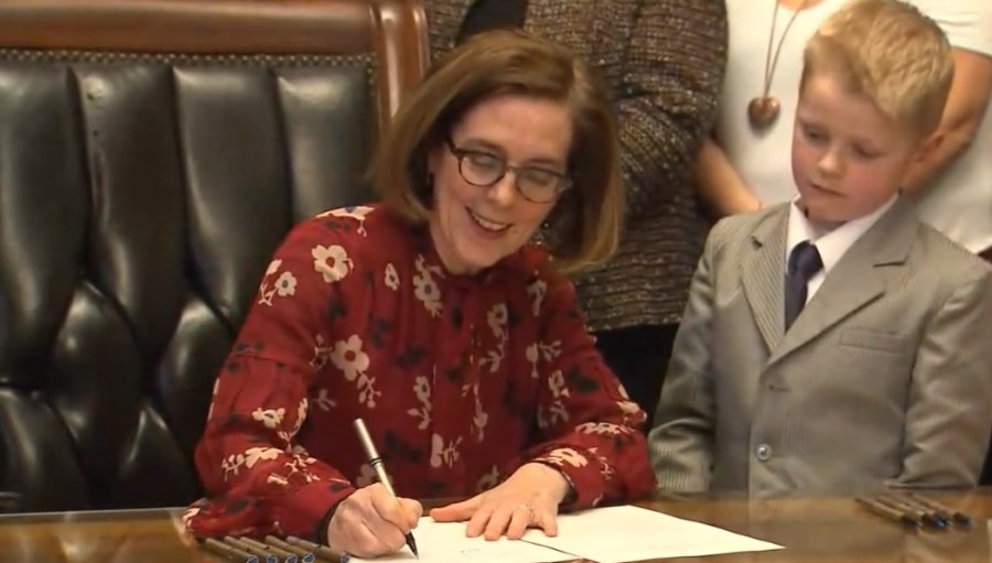 Governor Brown signs rent control bill into law, February 28 2019. (KOIN)