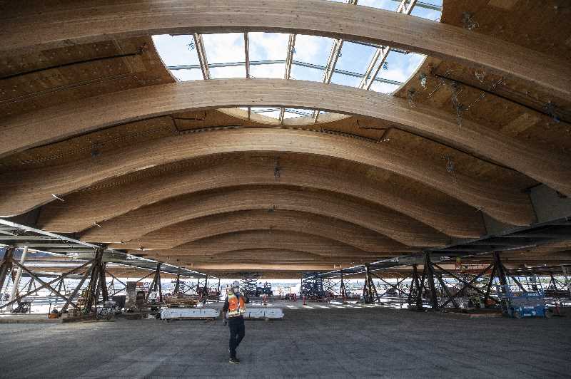 Vince Granato, the Chief Projects Officer at Port of Portland, under the Portland International Airport's upcoming mass timber roof for the main terminal, 2021 (Pamplin Media Group/Jonathan House)