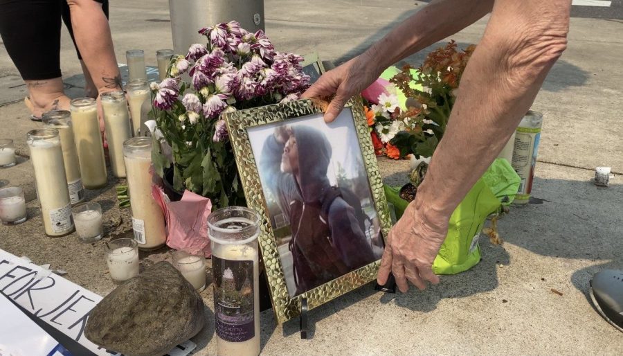 Family of Jermelle Madison Jr. redecorate the memorial after an former Clackamas County employee vandalized the site with hate symbols Aug. 2021 (Joelle Jones, KOIN)