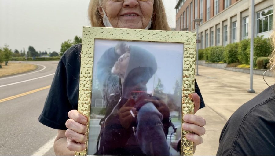 Lynette Madison holds an image of her late grandson Jermelle at his memorial in Oregon City (Joelle Jones, KOIN)