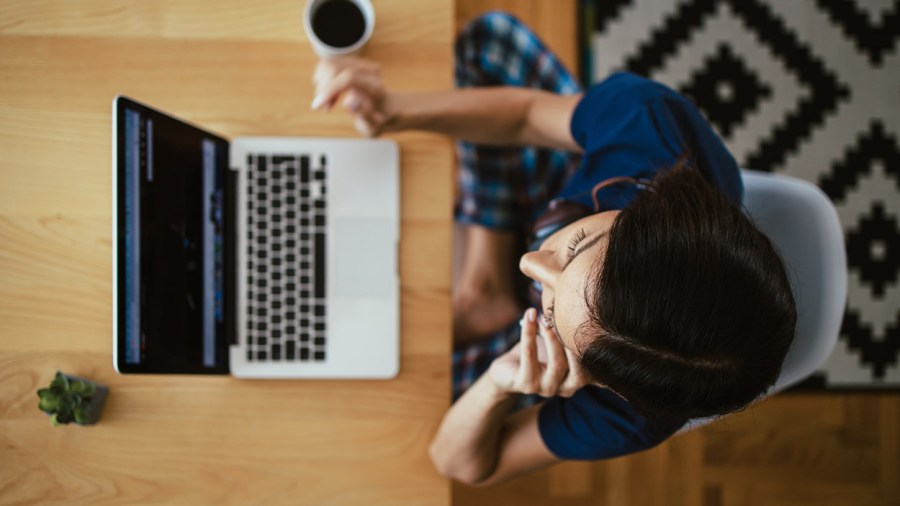 A person sits at a computer (Getty Images