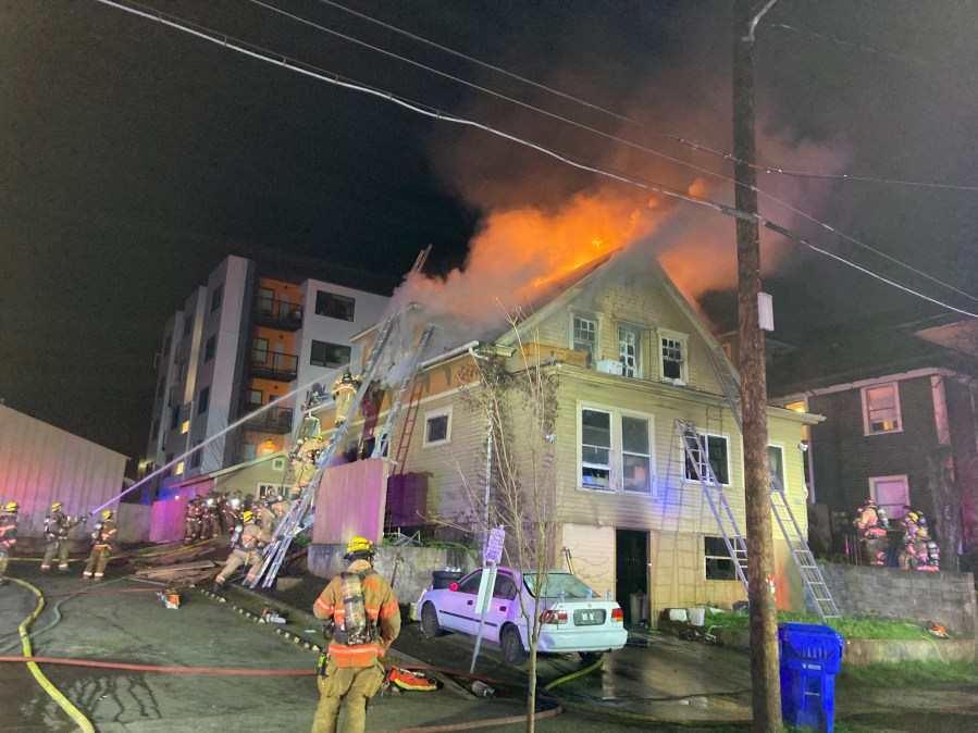 A woman was rushed to the hospital after a two-alarm blaze in North Portland early Thursday morning, Portland Fire & Rescue said.