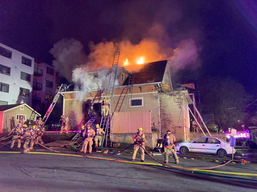 A woman was rushed to the hospital after a two-alarm blaze in North Portland early Thursday morning, Portland Fire & Rescue said.