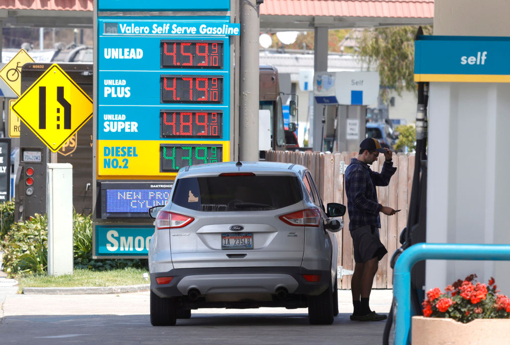 MILL VALLEY, CALIFORNIA - JULY 12: A customer prepares to pump gasoline into his car at a Valero station on July 12, 2021 in Mill Valley, California. (Photo by Justin Sullivan/Getty Images)