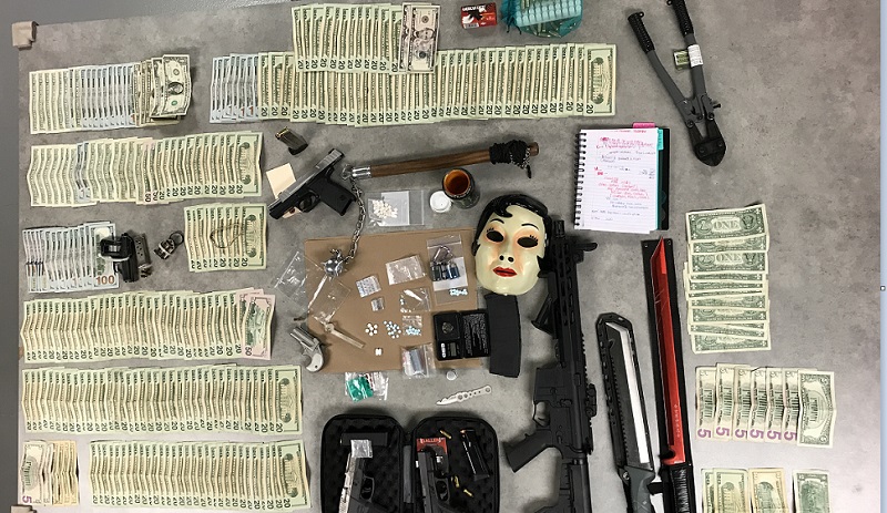 Guns, swords, drugs, cash found in McMinnville bust