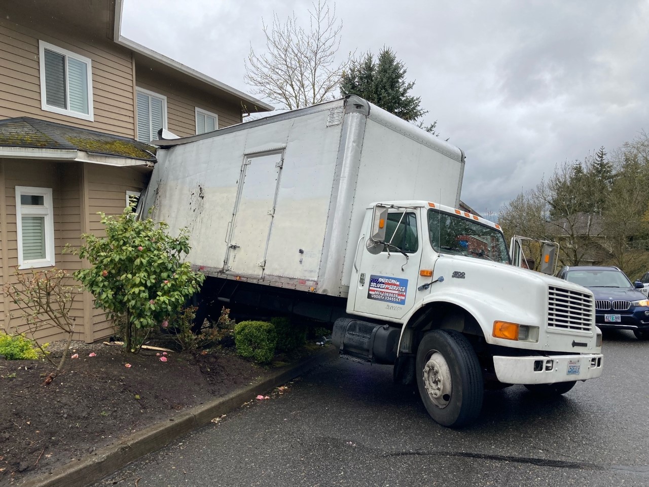 A box truck crashed into a house in northwest Portland while a person was inside on Tuesday afternoon, Portland Fire & Rescue said.