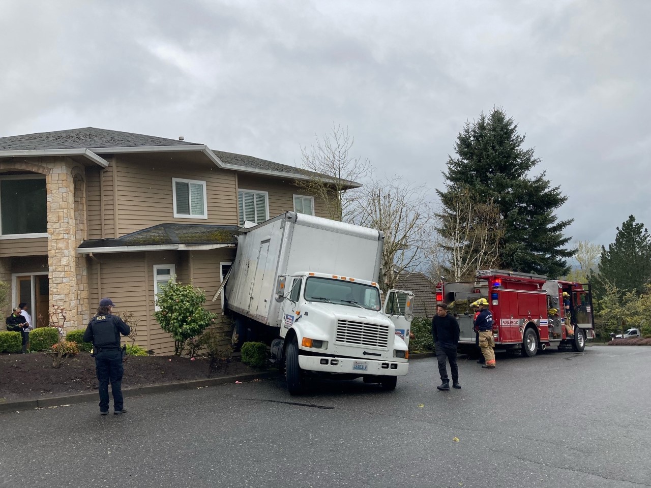 A box truck crashed into a house in northwest Portland while a person was inside on Tuesday afternoon, Portland Fire & Rescue said.