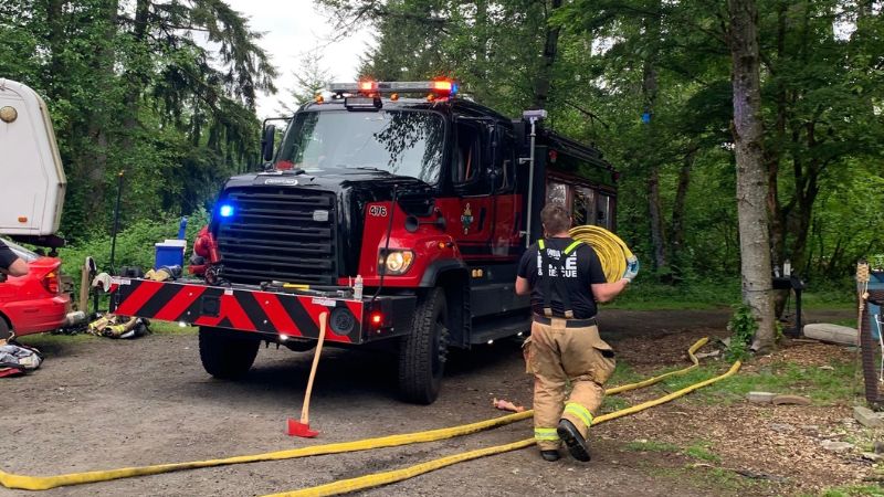 Off-duty deputy chief rescues woman from Rainier house fire