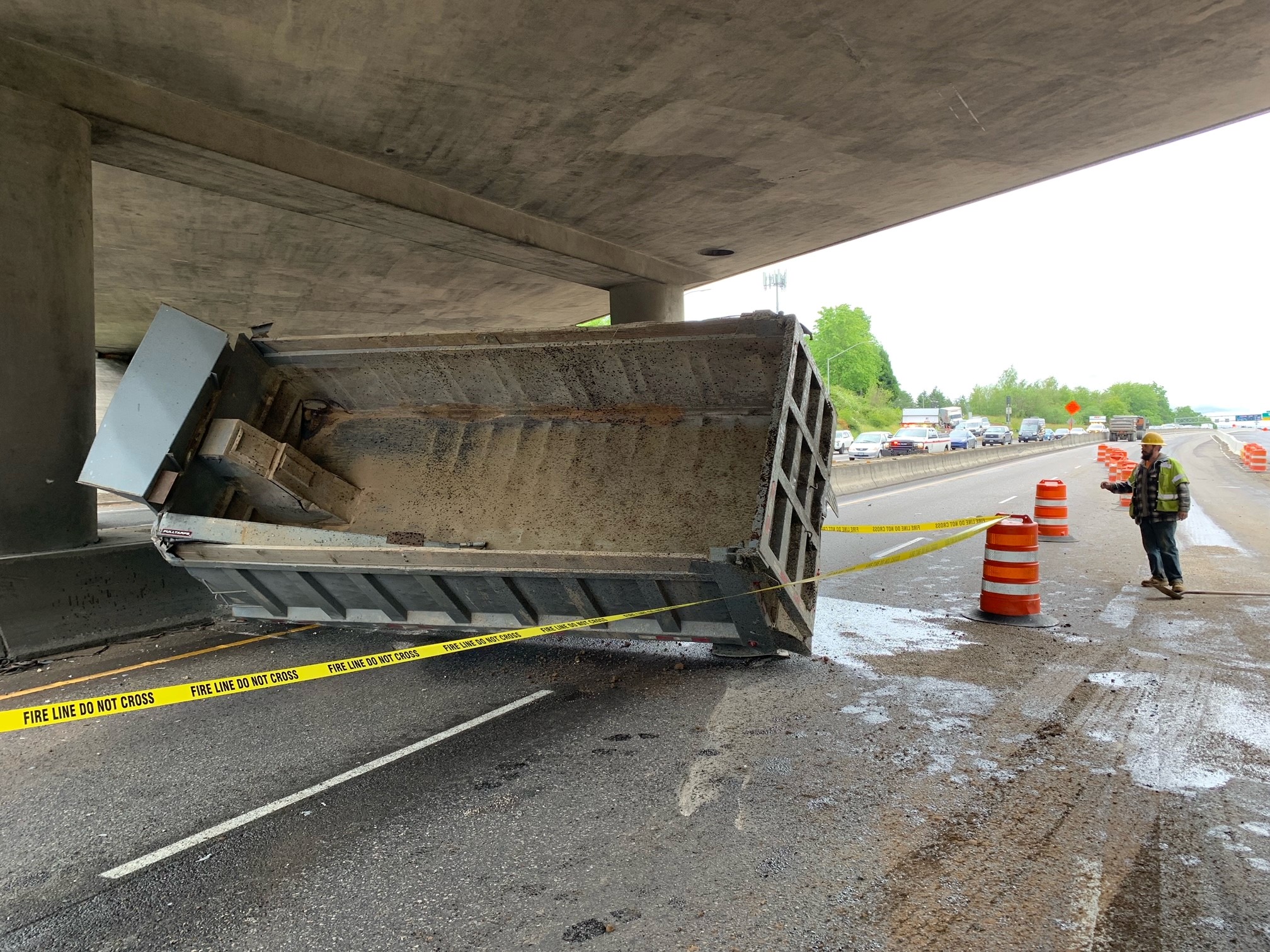 Highway 217 southbound lanes closed late Friday morning after a dump truck crashed into the overpass near Hall Boulevard.