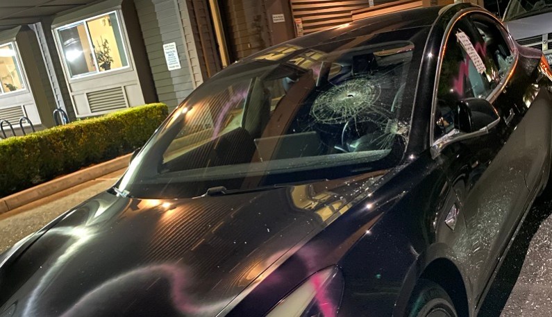 A group of protesters marched down Sandy Boulevard in Portland and vandalized businesses and damaged this Tesla, June 25, 2022 (KOIN)