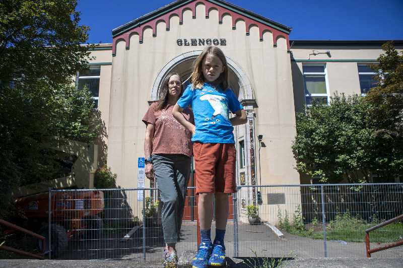 Isabel Johnson and her son Everett, who attends Glencoe Elementary in Southeast Portland. The schools PTA, led by Johnson, has pressured Portland Public Schools to prevent packing up to 32 students in elementary school classrooms this fall.