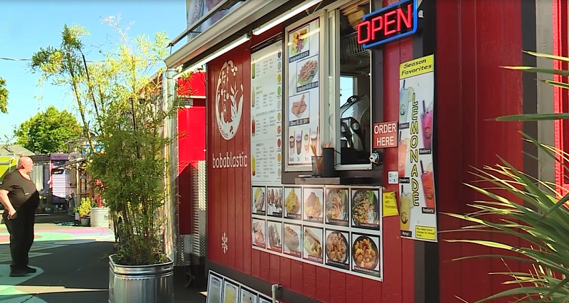 A customer outside food carts on SE Foster in Portland, July 25, 2022 (KOIN)