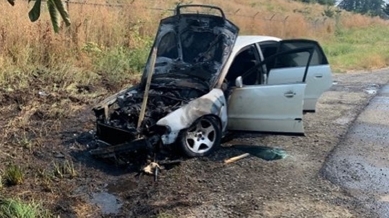 A suspicious fire that torched this silver Audi spread to brush in Hillsboro, July 31, 2022 (WCSO)