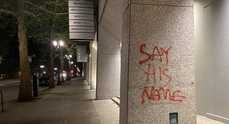 Dozens of protesters marched through the streets of downtown Portland and smashed windows at multiple businesses while tagging businesses and buildings, July 4, 2022 (KOIN)