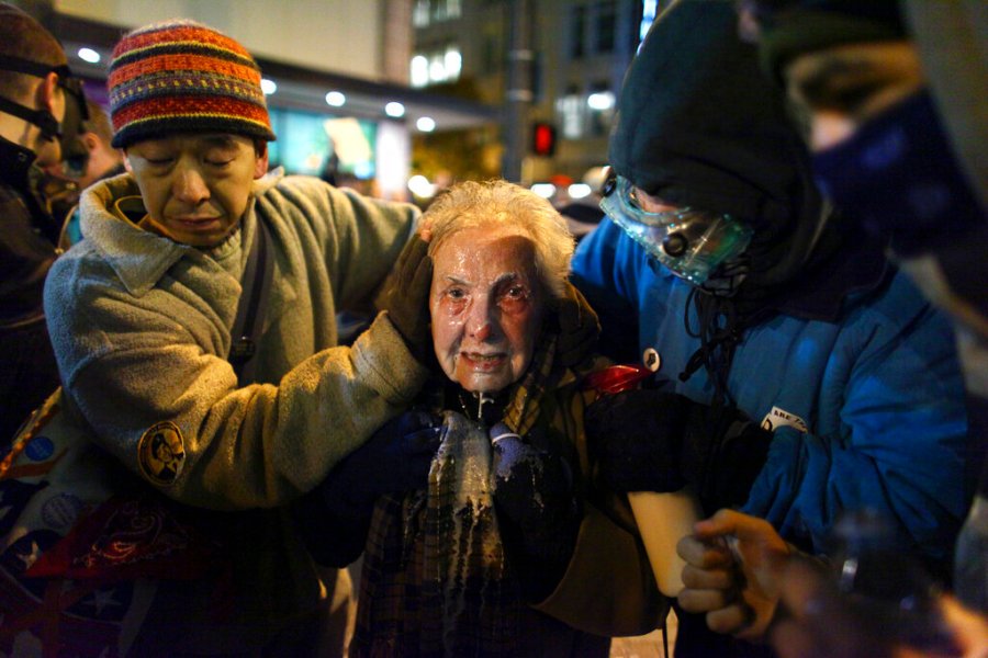 Seattle activist Dorli Rainey, 84, reacts after being hit with pepper spray during an Occupy Seattle protest on Nov. 15, 2011 at Westlake Park in Seattle. (Joshua Trujillo/seattlepi.com via AP, File)