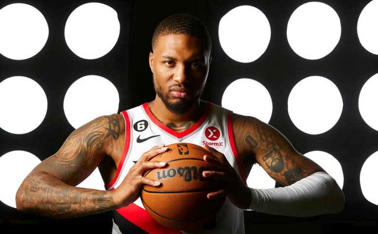 Portland Trail Blazers guard Damian Lillard poses for a portrait during the NBA basketball team's media day in Portland, Ore., Monday, Sept. 26, 2022. (AP Photo/Craig Mitchelldyer)