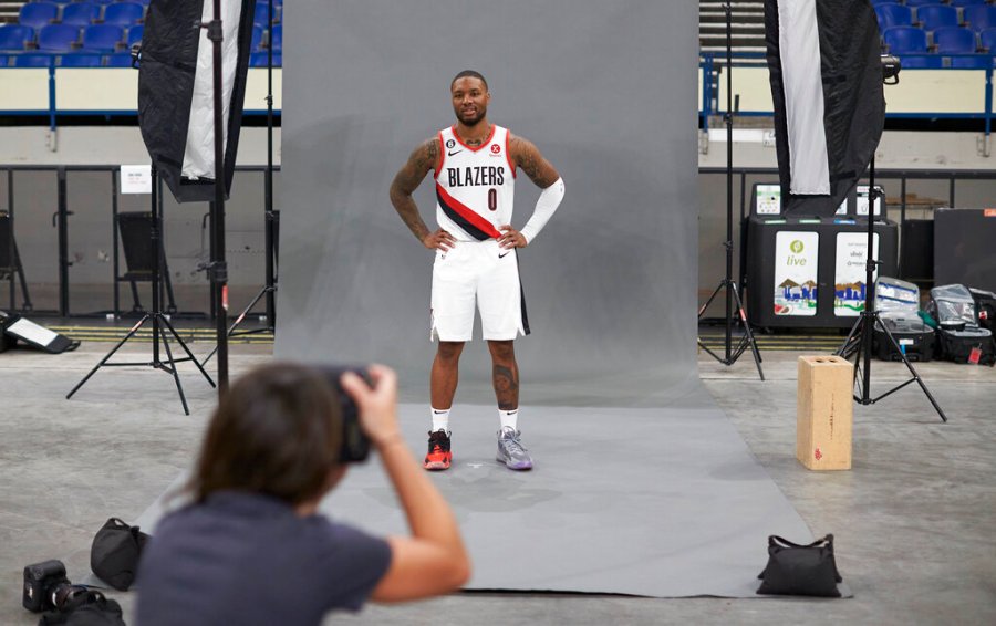 Portland Trail Blazers guard Damian Lillard poses for photographer Steph Chambers during the NBA basketball team's media day in Portland, Ore., Monday, Sept. 26, 2022. (AP Photo/Craig Mitchelldyer)