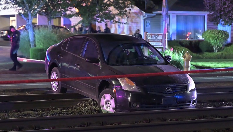 A wounded man was found next to a car "high-centered on the MAX tracks" along East Burnside Street, September 17, 2022 (KOIN)