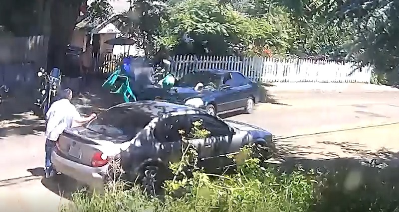 Surveillance video shows a car plowing through garbage cans and trash outside the Hendon house on North Houghton Street in Portland's Kenton neighborhood, undated, provided September 2022 (Courtesy)