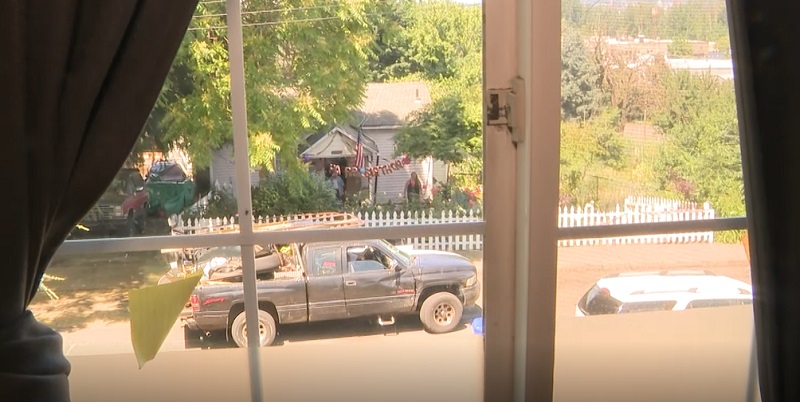 A truck without license plates drives by the Hendon house on North Houghton Street in Portland's Kenton neighborhood, September 2022 (KOIN)