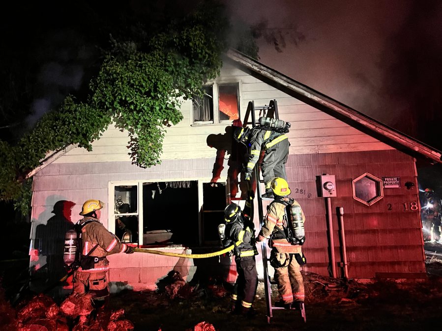 Firefighters attack a vacant house fire in Longview on Friday, Sept. 2, 2022 