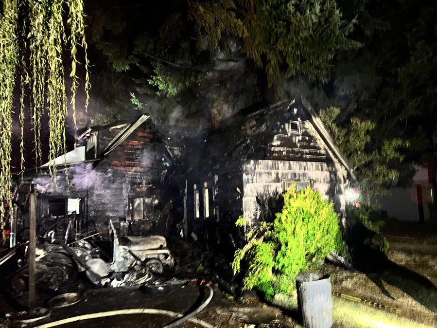 A vacant house ignited overnight before spreading to a garage and nearby tree on Friday, Sept. 2, 2022