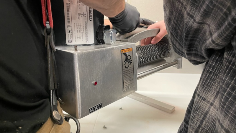 Officials: Portland, OR supermarket employee gets hand stuck in meat machine