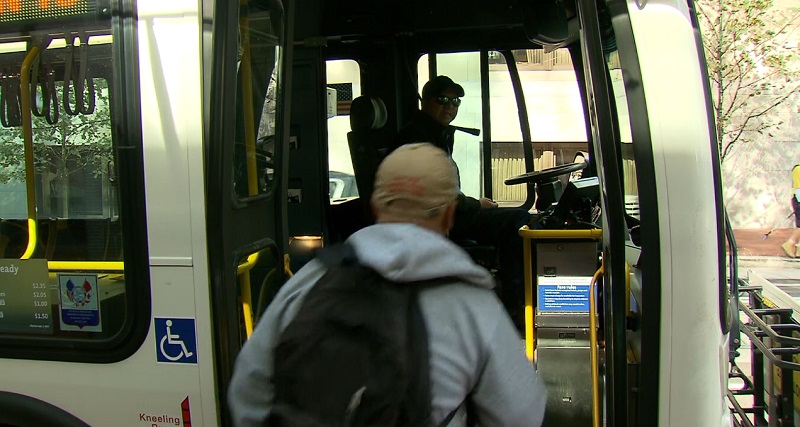 A rider gets on a TriMet bus in Portland, September 2022 (KOIN)