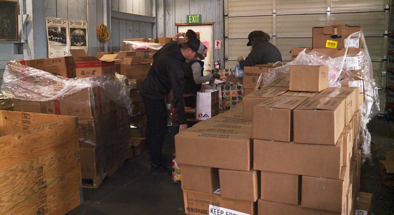 Boxes and bags of food are put together at one of the Sunshine Division warehouses in Portland, November 2022 (KOIN)