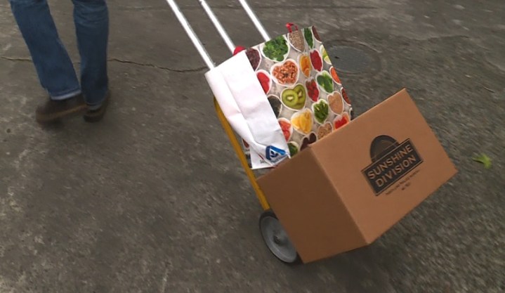 Boxes and bags of food are put together at one of the Sunshine Division warehouses in Portland, November 2022 (KOIN)