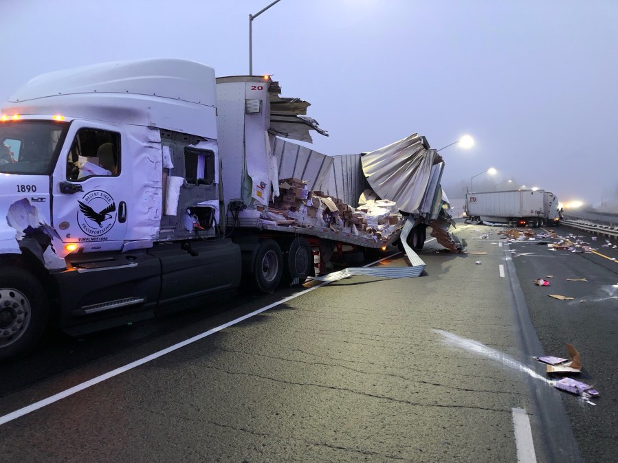 A semi-truck crash spills debris on I-84 on Thursday, Nov. 17, 2022