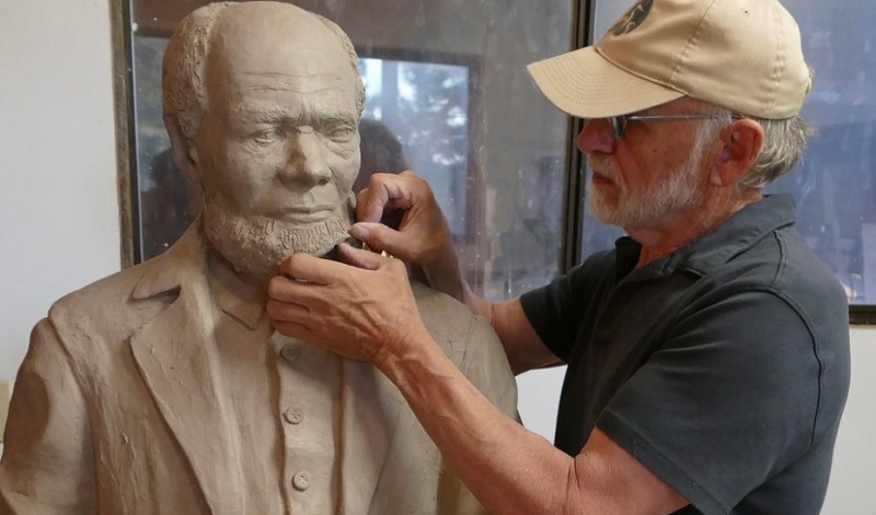 Sculptor Peter Helzer works on a statue of Louis Southworth, to be displayed in Louis Southworth Park in Waldport (City of Waldport)