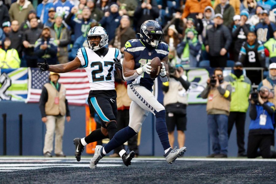 DK Metcalf #14 of the Seattle Seahawks runs in for a touchdown after a catch in the second quarter of the game against the Carolina Panthers at Lumen Field on December 11, 2022 in Seattle, Washington. (Photo by Steph Chambers/Getty Images)