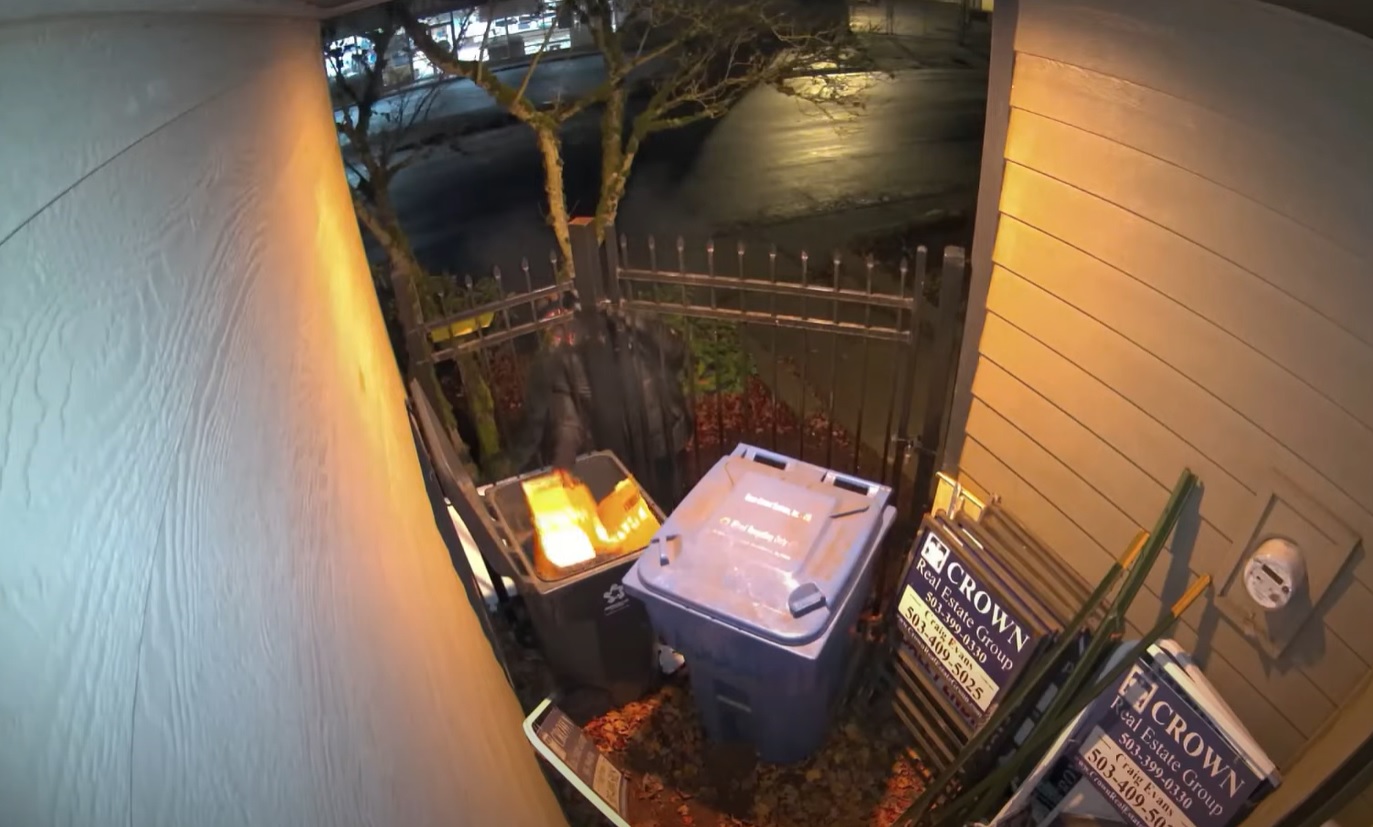 Surveillance video from a West Salem business shows a person lighting a fire in a garbage can on December 12, 2022.